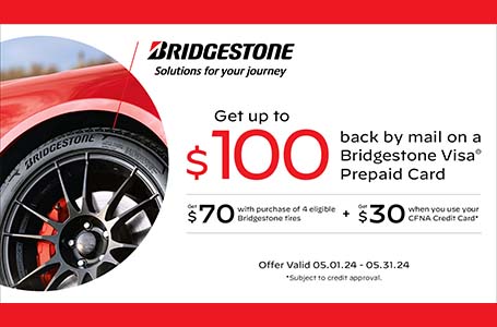Heinold & Feller | Promotional advertisement featuring a close-up of a car tire with the Firestone logo, and text offering up to $100 back via a Visa prepaid card with tire purchase and credit card use.